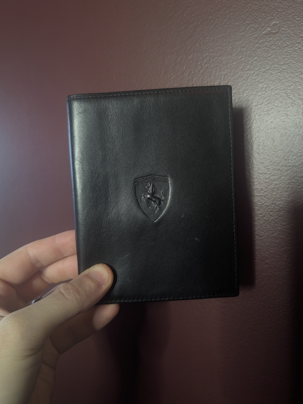 FERRARI Black Leather Passport Wallet with Embossed Shield Logo Red Inside